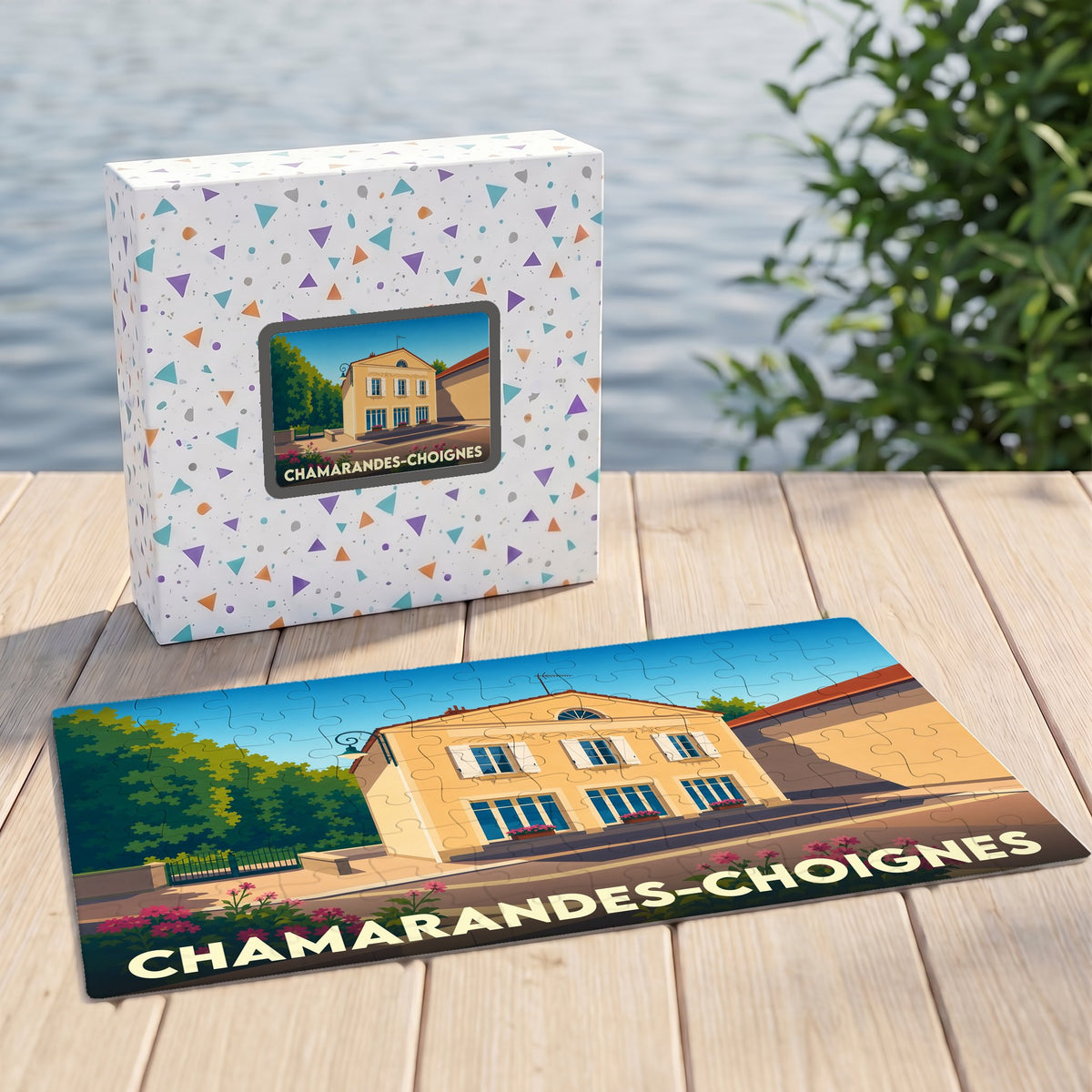 Puzzle souvenir de Chamarandes-Choignes présentant une illustration stylisée de la commune sur sa boîte et ses pièces.