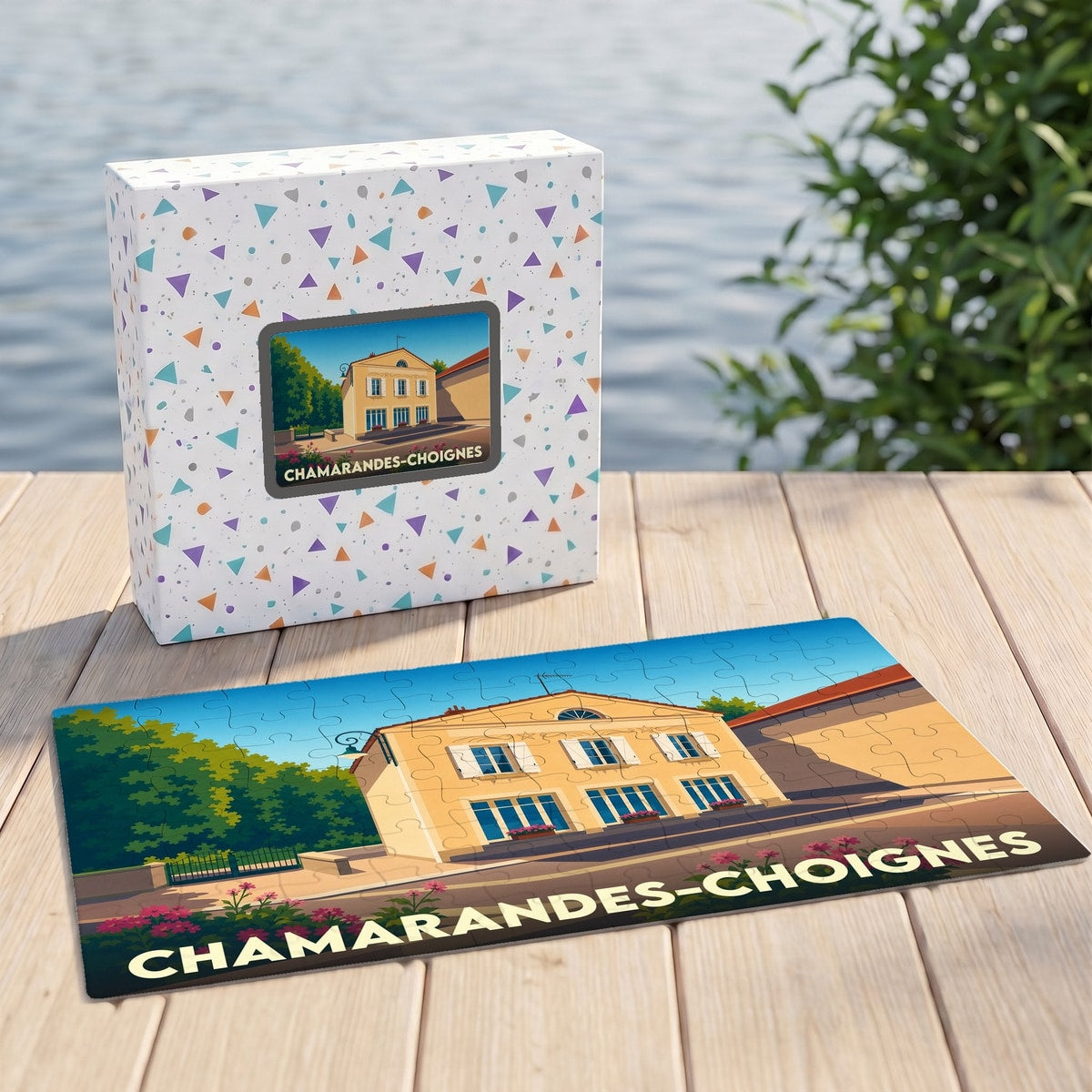 Puzzle souvenir de Chamarandes-Choignes présentant une illustration stylisée de la commune sur sa boîte et ses pièces.
