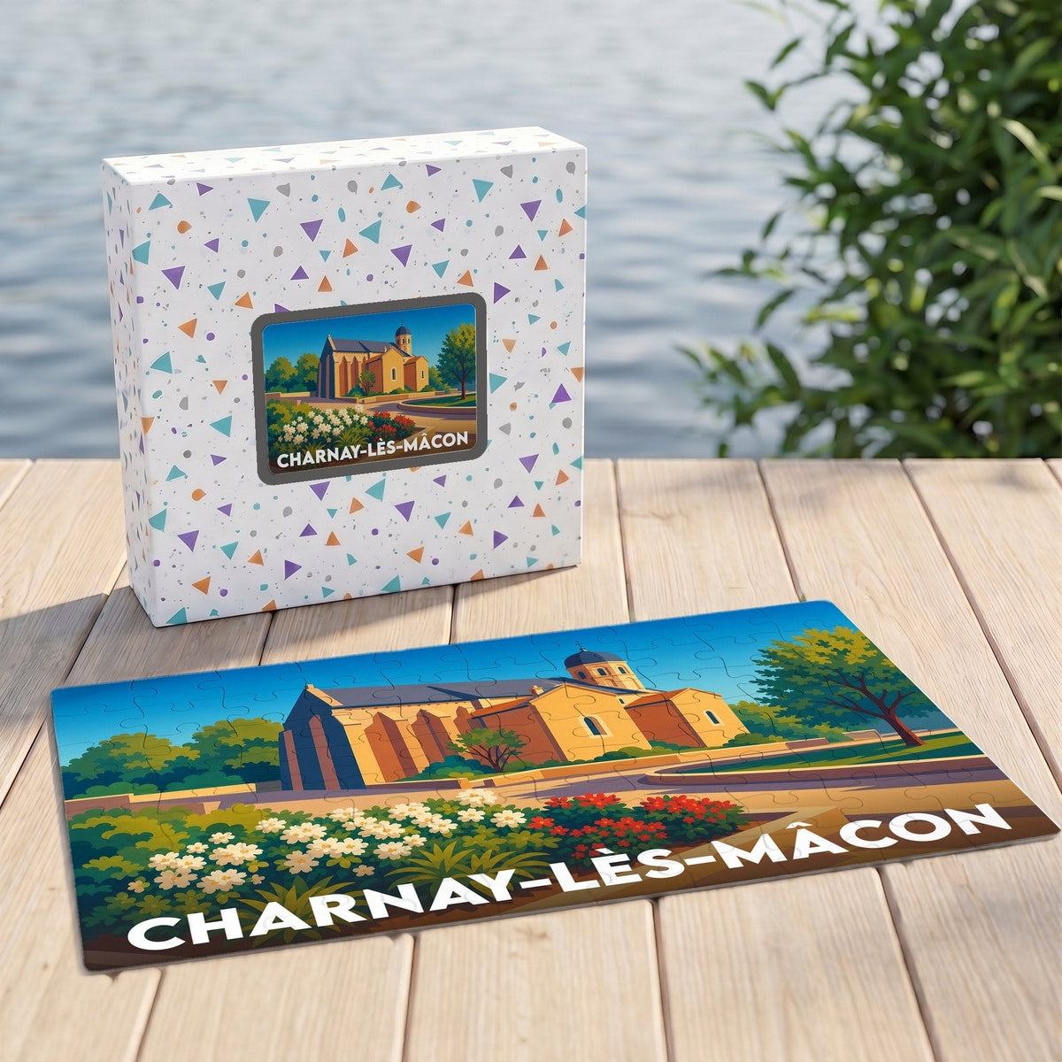 Puzzle souvenir de la ville de Charnay-lès-Mâcon illustrant une église de style roman dans un paysage coloré.