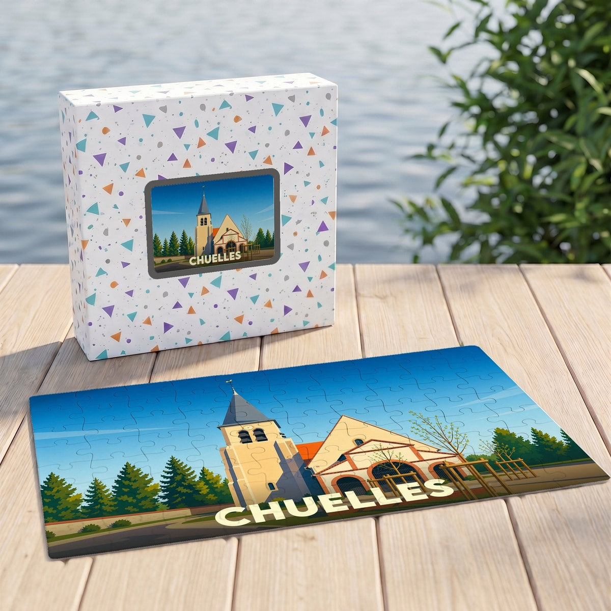 Puzzle souvenir de la ville de Chuelles avec une illustration stylisée d'une église et de son clocher.