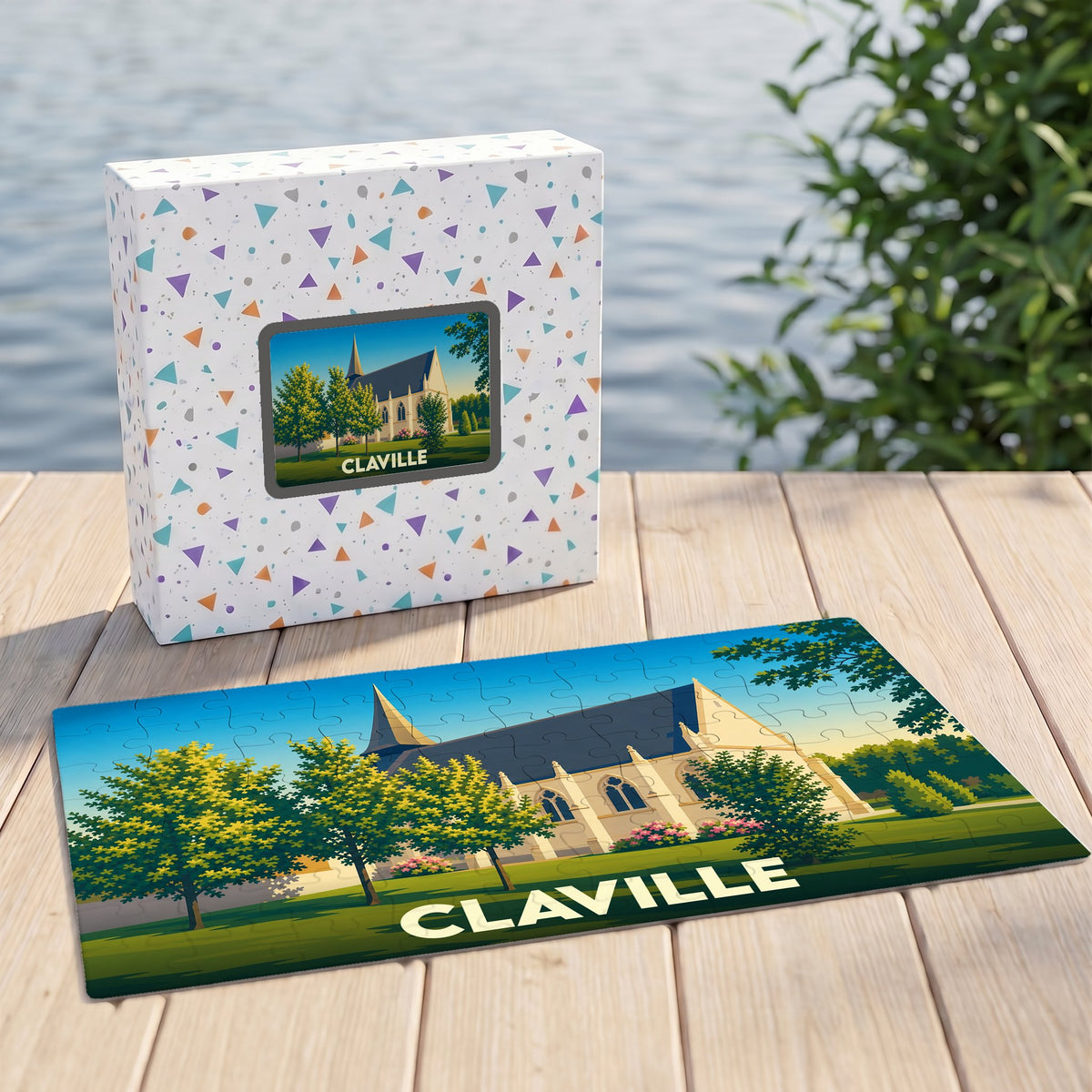 Puzzle souvenir de la ville de Claville accompagné de sa boîte illustrée d'un décor champêtre.
