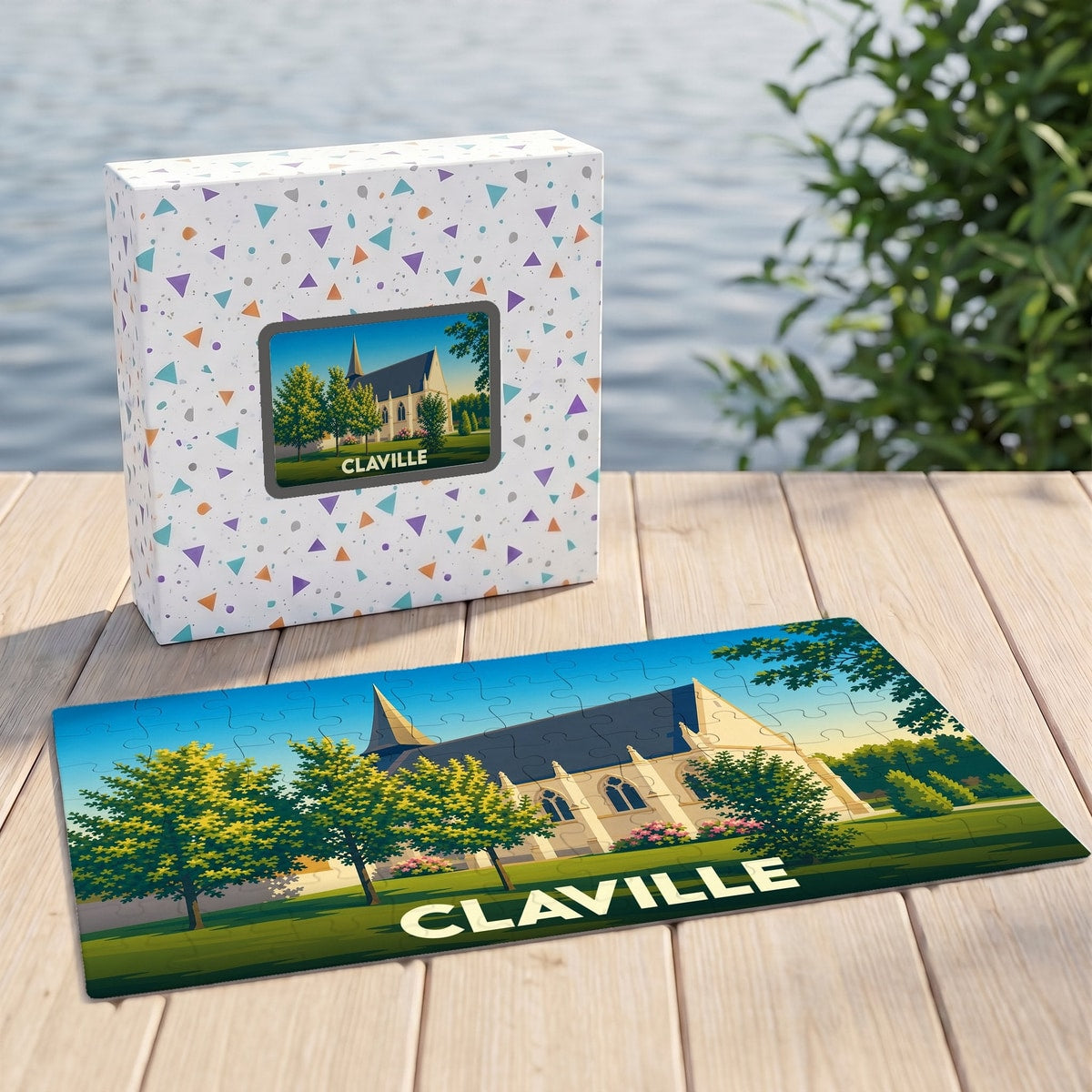 Puzzle souvenir de la ville de Claville accompagné de sa boîte illustrée d'un décor champêtre.