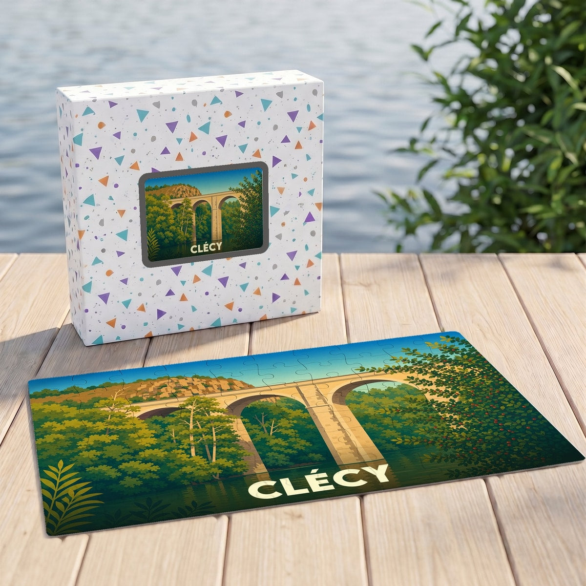 Puzzle souvenir de la ville de Clécy avec une illustration stylisée d'un viaduc.