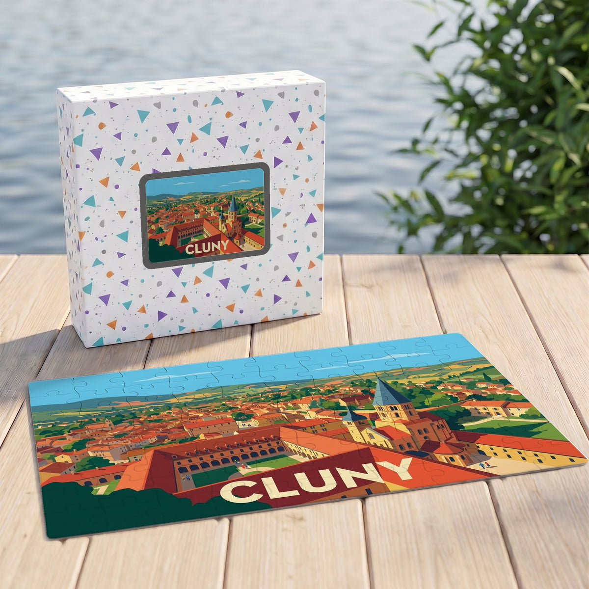Puzzle souvenir de la ville de Cluny avec une illustration panoramique stylisée et sa boîte assortie.