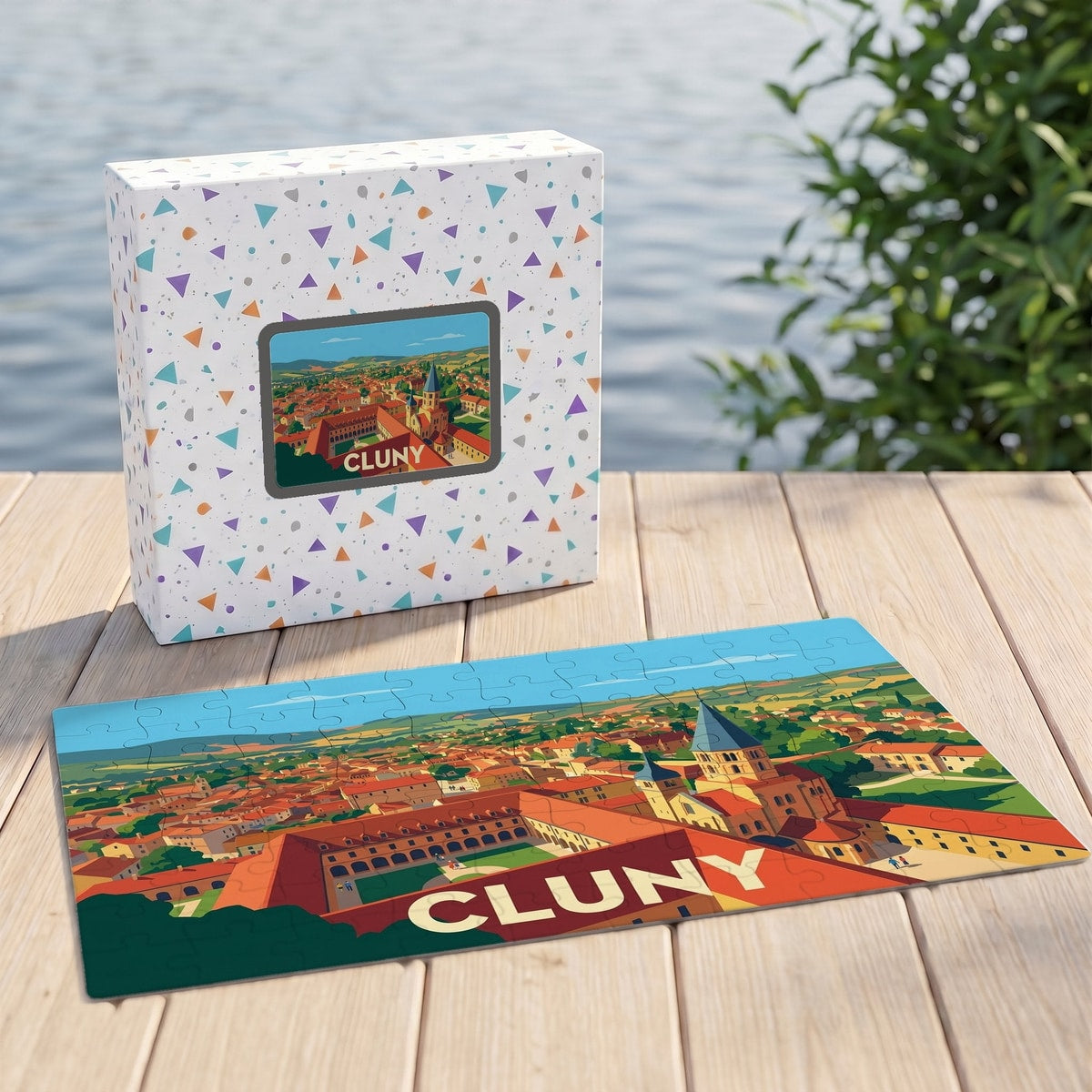 Puzzle souvenir de la ville de Cluny avec une illustration panoramique stylisée et sa boîte assortie.