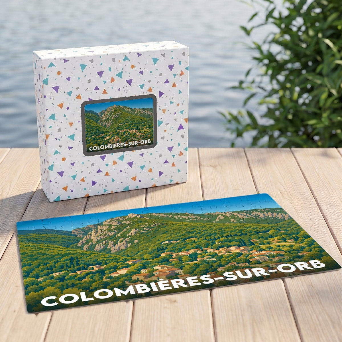 Puzzle souvenir de la ville de Colombières-sur-Orb avec une illustration paysagère stylisée.