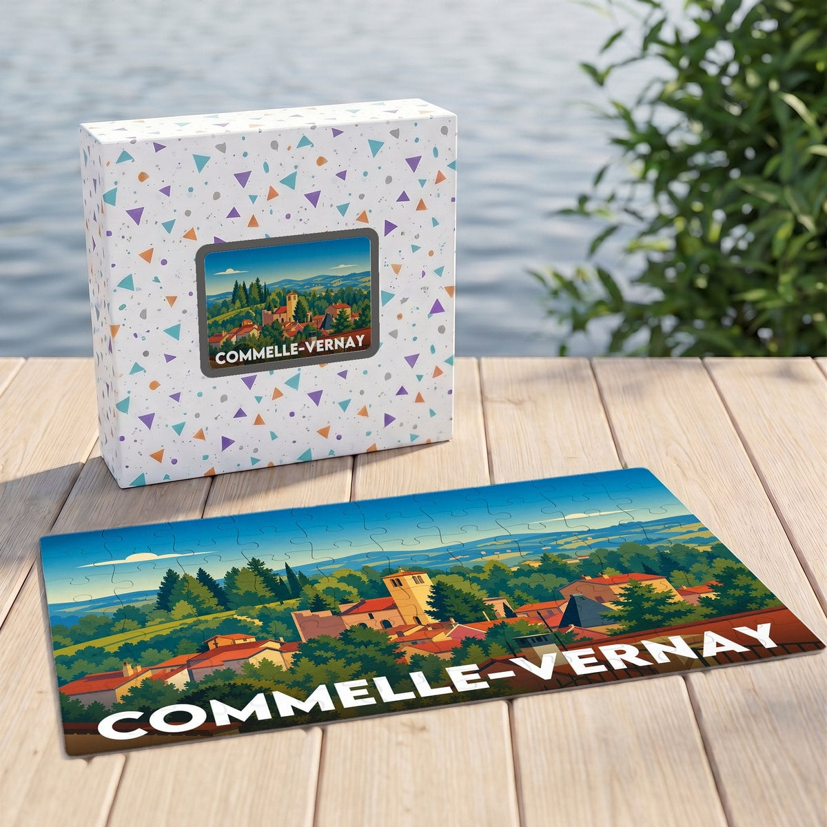 Puzzle souvenir de la ville de Commelle-Vernay avec une illustration paysagère stylisée.