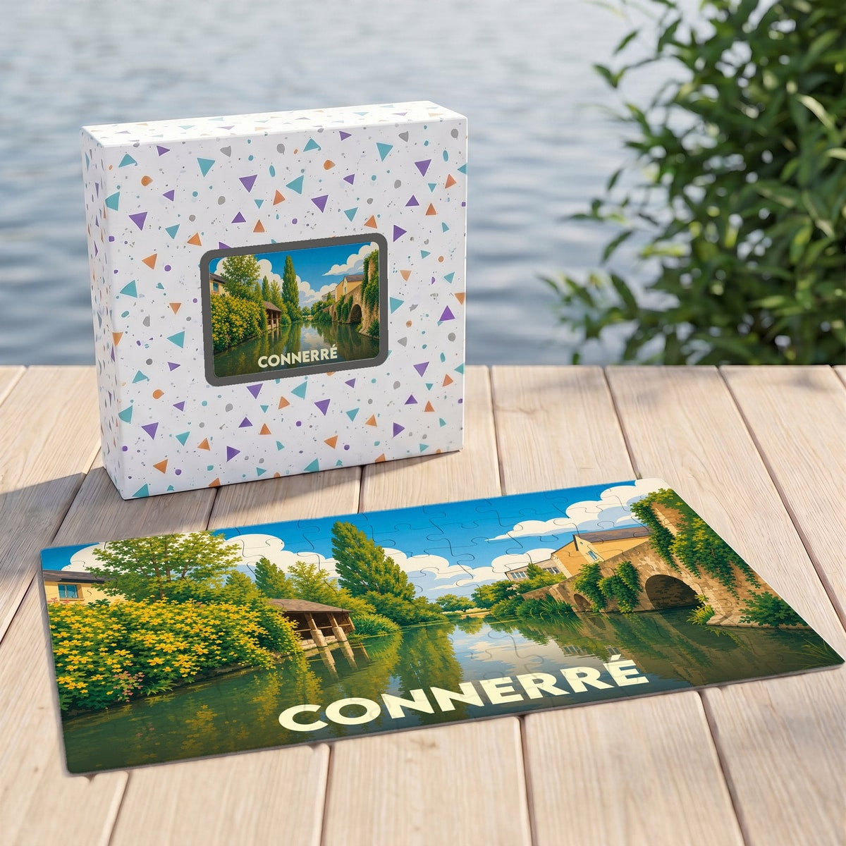 Puzzle souvenir de la ville de Connerré représentant un paysage verdoyant au bord de l'eau.