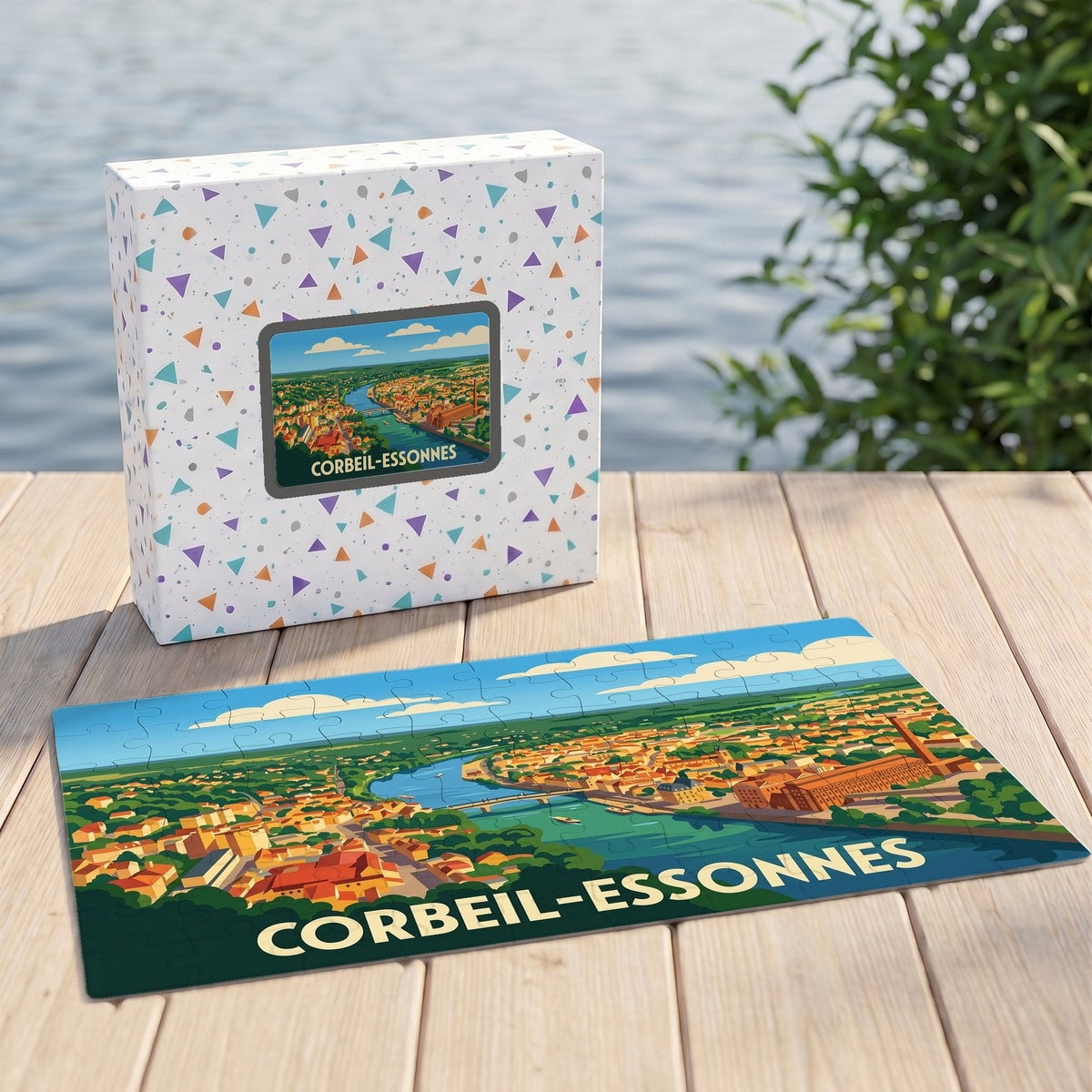 Puzzle souvenir de la ville de Corbeil-Essonnes illustré d'une vue aérienne stylisée au bord de l'eau.