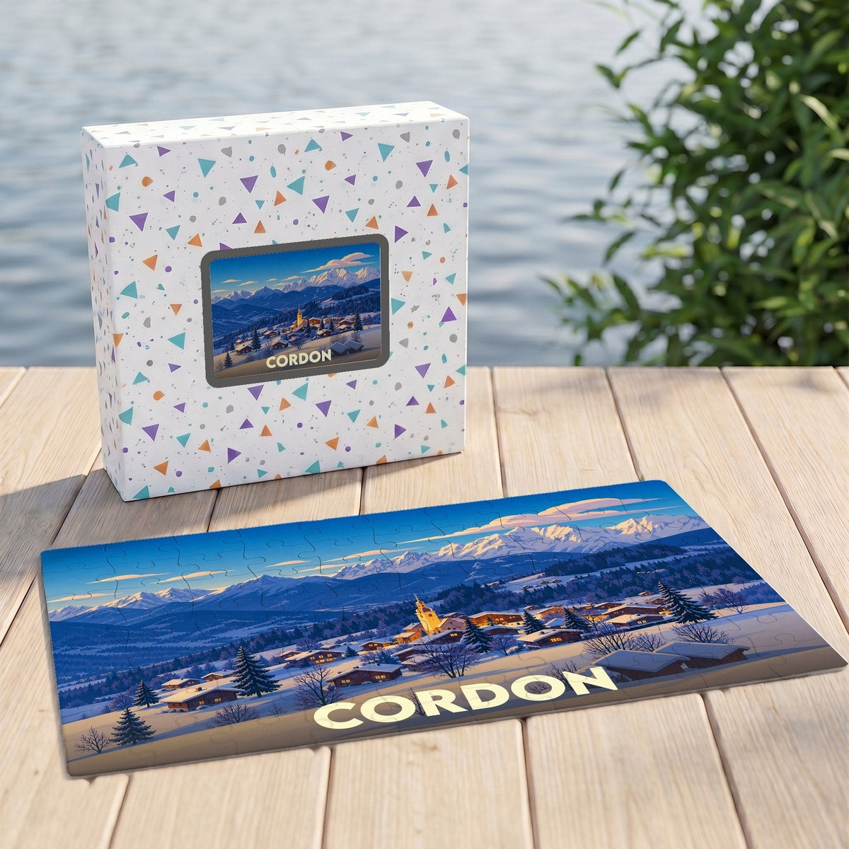 Puzzle souvenir de la ville de Cordon avec une illustration hivernale stylisée des montagnes.