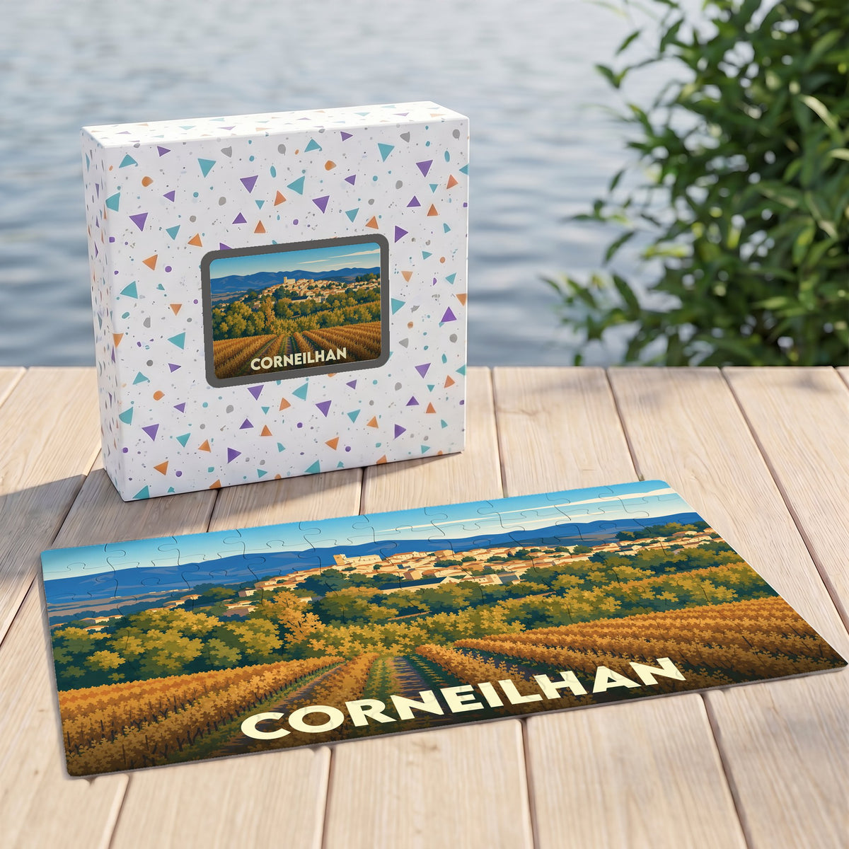 Puzzle souvenir de la ville de Corneilhan représentant un paysage de vignobles et de collines dans un style illustré.