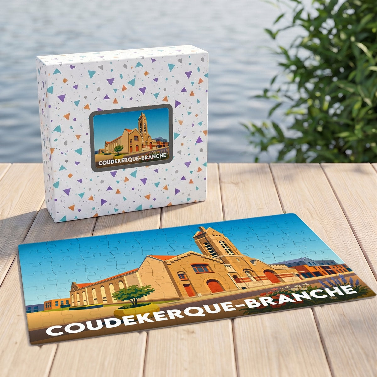 Puzzle souvenir de la ville de Coudekerque-Branche avec une illustration stylisée de son église et de son beffroi.