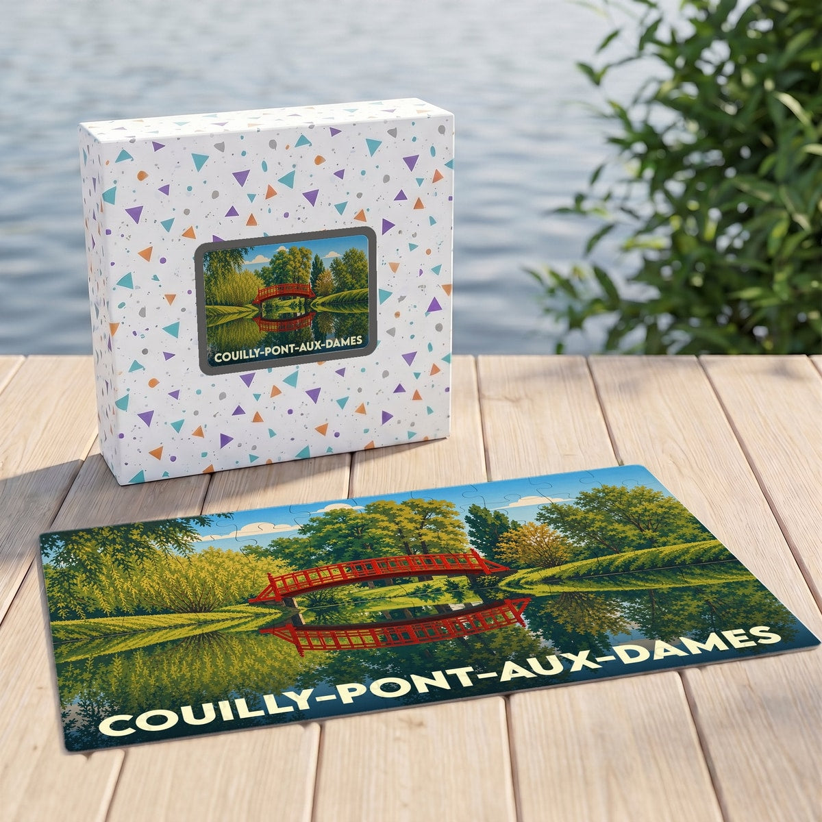 Puzzle souvenir de la ville de Couilly-Pont-aux-Dames illustrant un pont rouge se reflétant dans l'eau.
