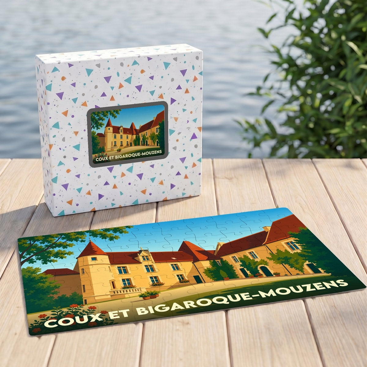 Puzzle souvenir de la ville de Coux et Bigaroque-Mouzens illustrant un château stylisé.
