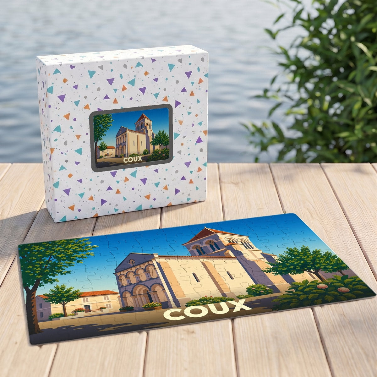 Puzzle souvenir de la ville de Coux illustrant une église de style roman sous un ciel bleu.