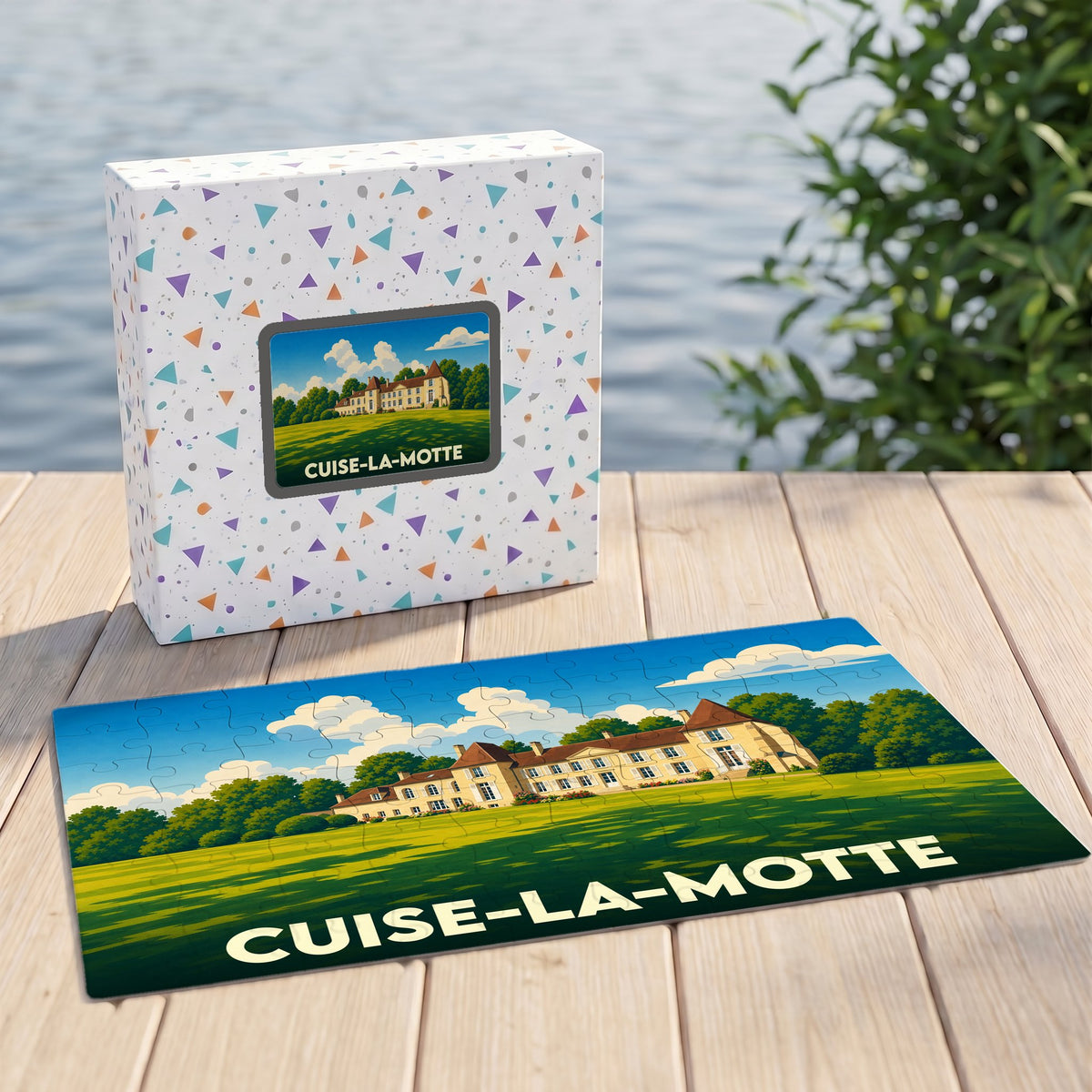 Puzzle souvenir de la ville de Cuise-la-Motte représentant un château dans un paysage verdoyant.