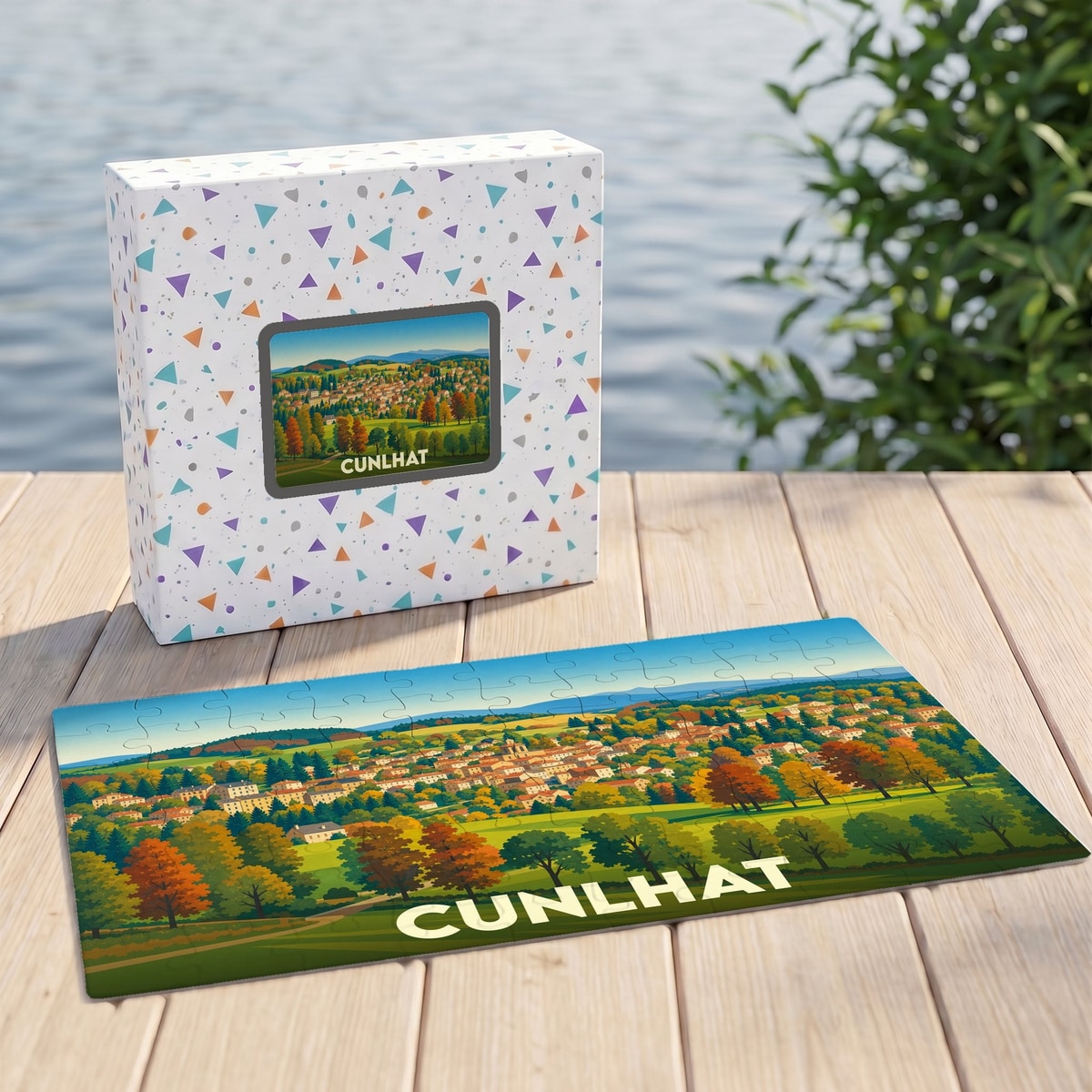 Puzzle souvenir de la ville de Cunlhat avec une illustration paysagère colorée.