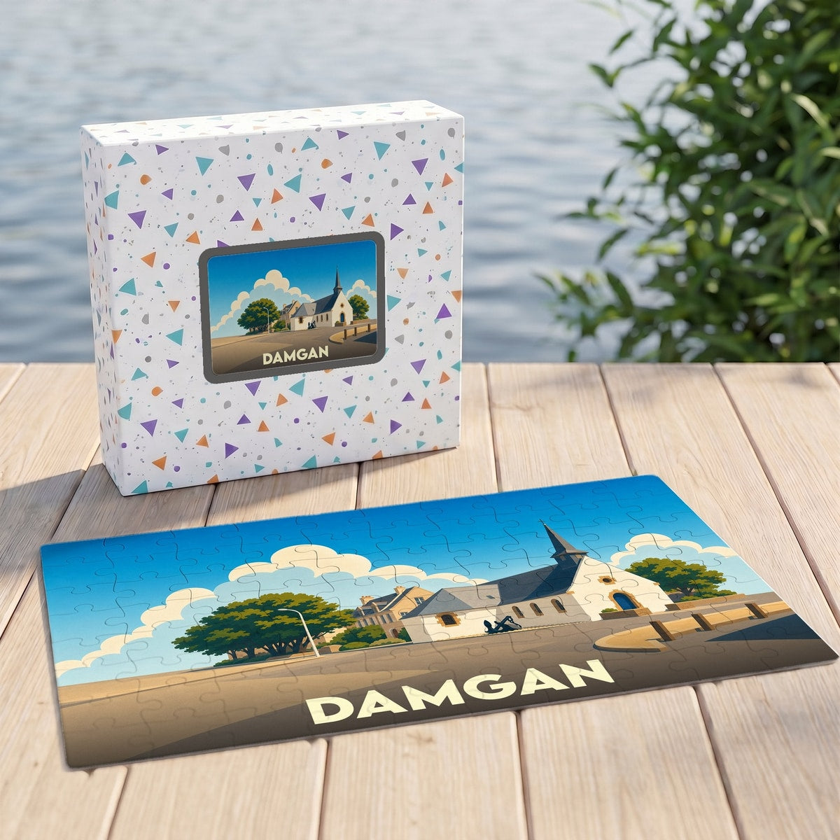 Puzzle souvenir de la ville de Damgan illustrant l'église locale sous un ciel ensoleillé.