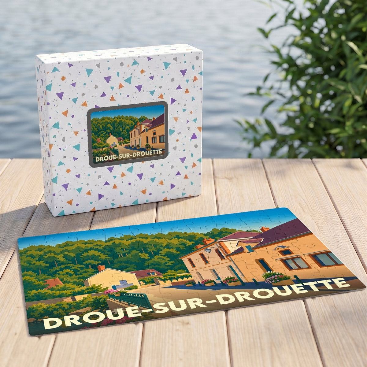 Puzzle souvenir de la ville de Droue-sur-Drouette avec une illustration stylisée d'un paysage urbain.