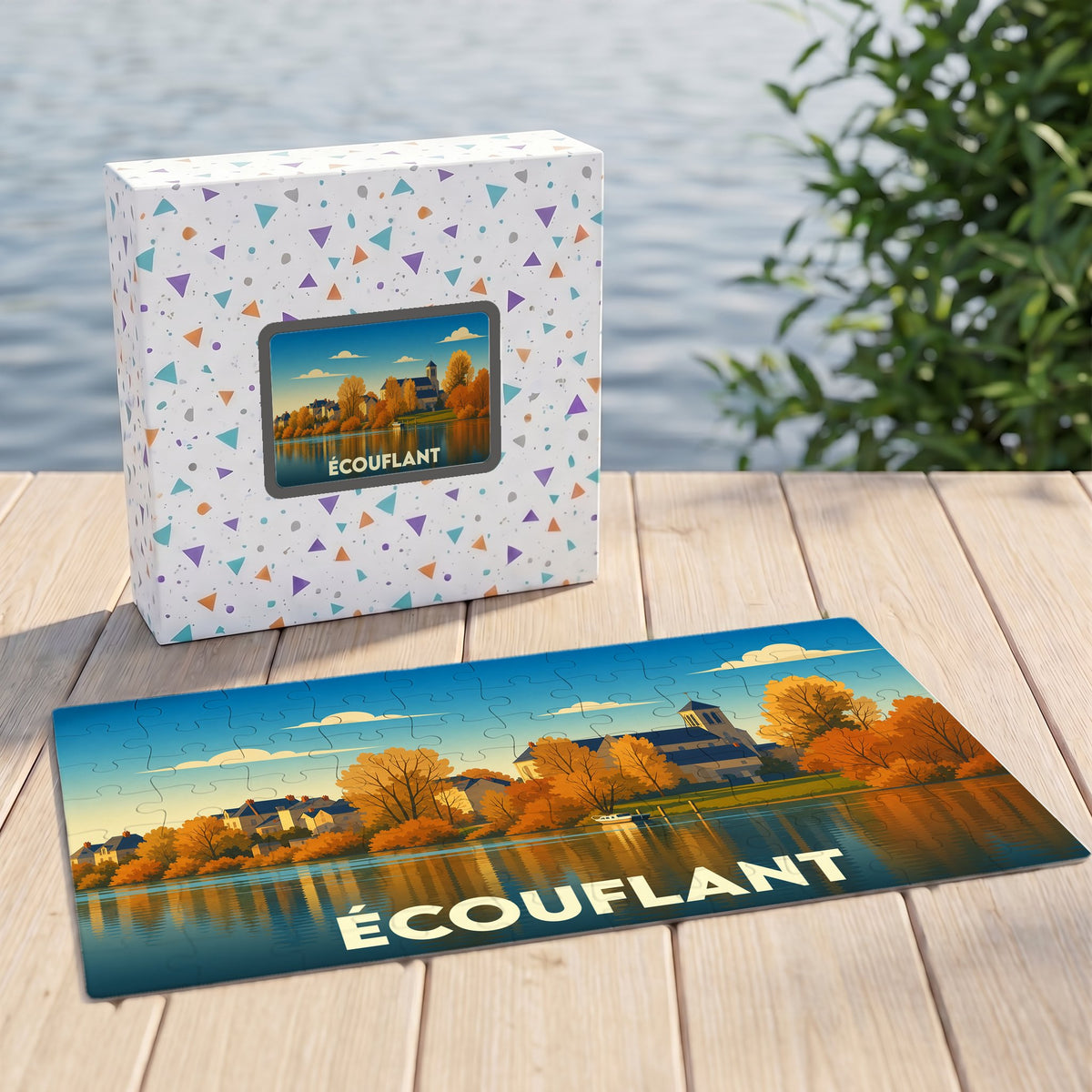 Puzzle souvenir de la ville d’Écouflant illustrant un paysage automnal au bord de l'eau.