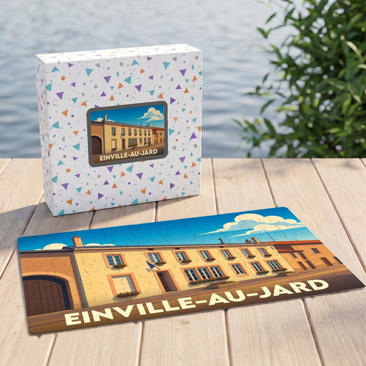 Puzzle souvenir de la ville de Einville-au-Jard avec une illustration stylisée et sa boîte assortie.