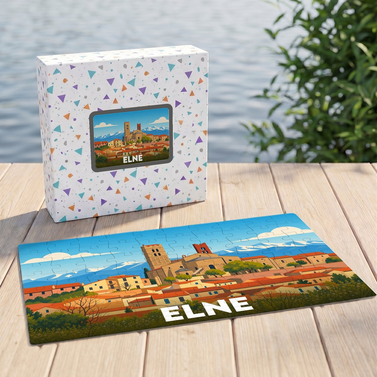 Puzzle souvenir de la ville d'Elne illustrant son paysage urbain et sa cathédrale dans un style coloré.
