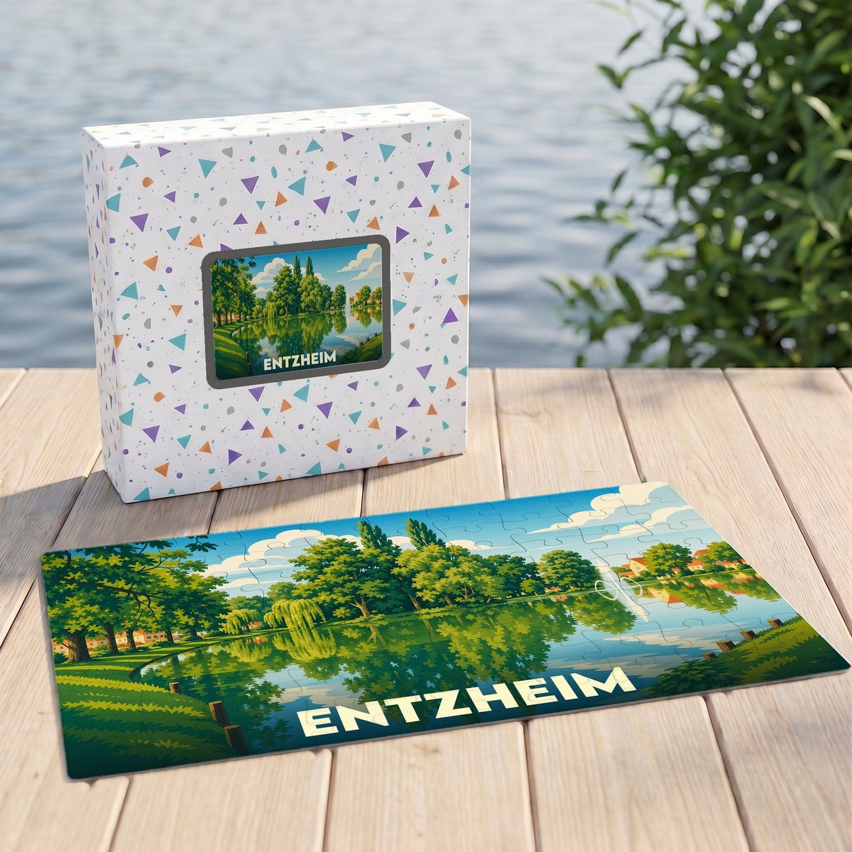 Puzzle souvenir de la ville de Entzheim avec une illustration stylisée d'un lac bordé de verdure.