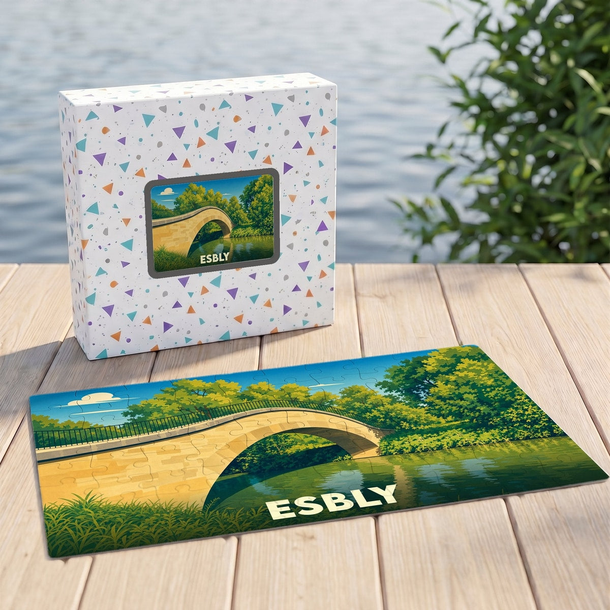 Puzzle souvenir de la ville d'Esbly illustrant un pont de pierre au-dessus d'une rivière calme.
