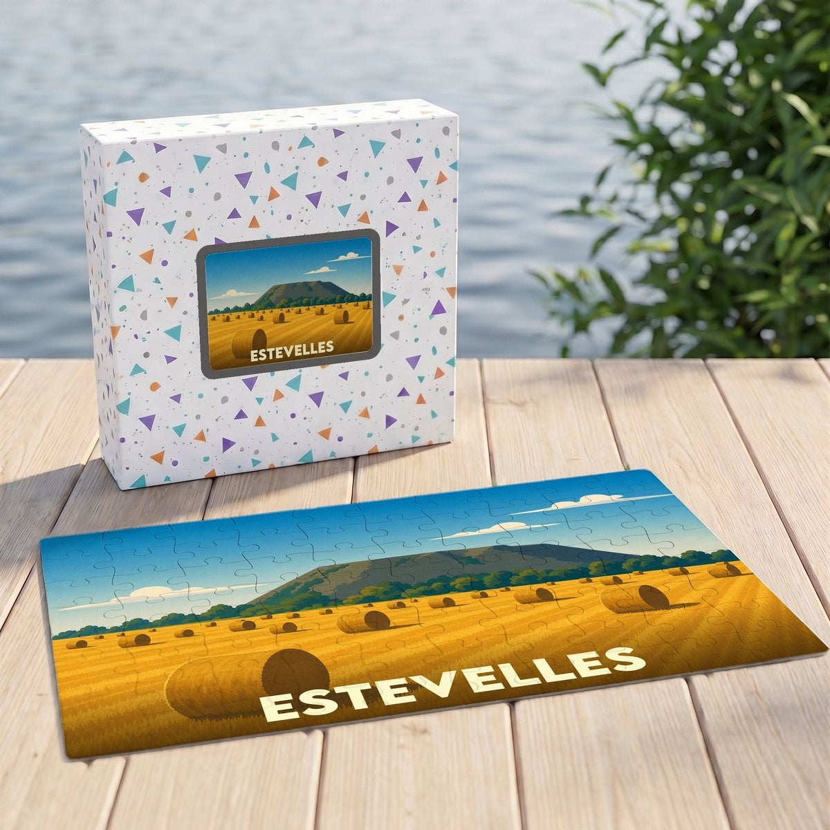 Puzzle souvenir de la ville d'Estevelles illustrant un paysage champêtre stylisé.