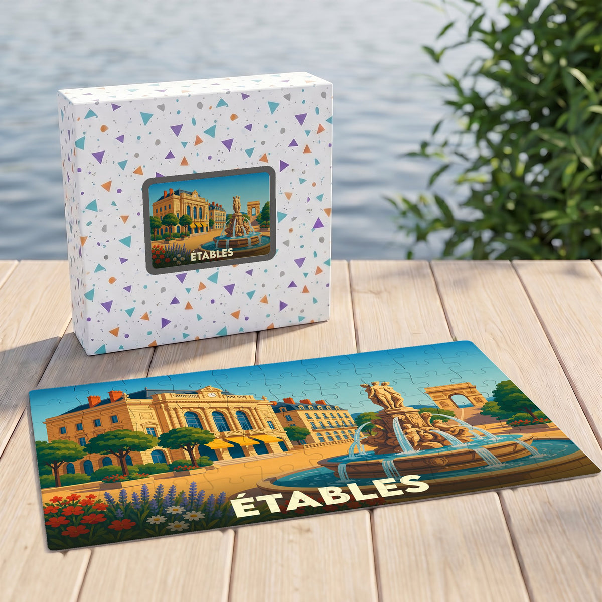 Puzzle souvenir de la ville d'Étables avec une illustration stylisée d'une place animée.