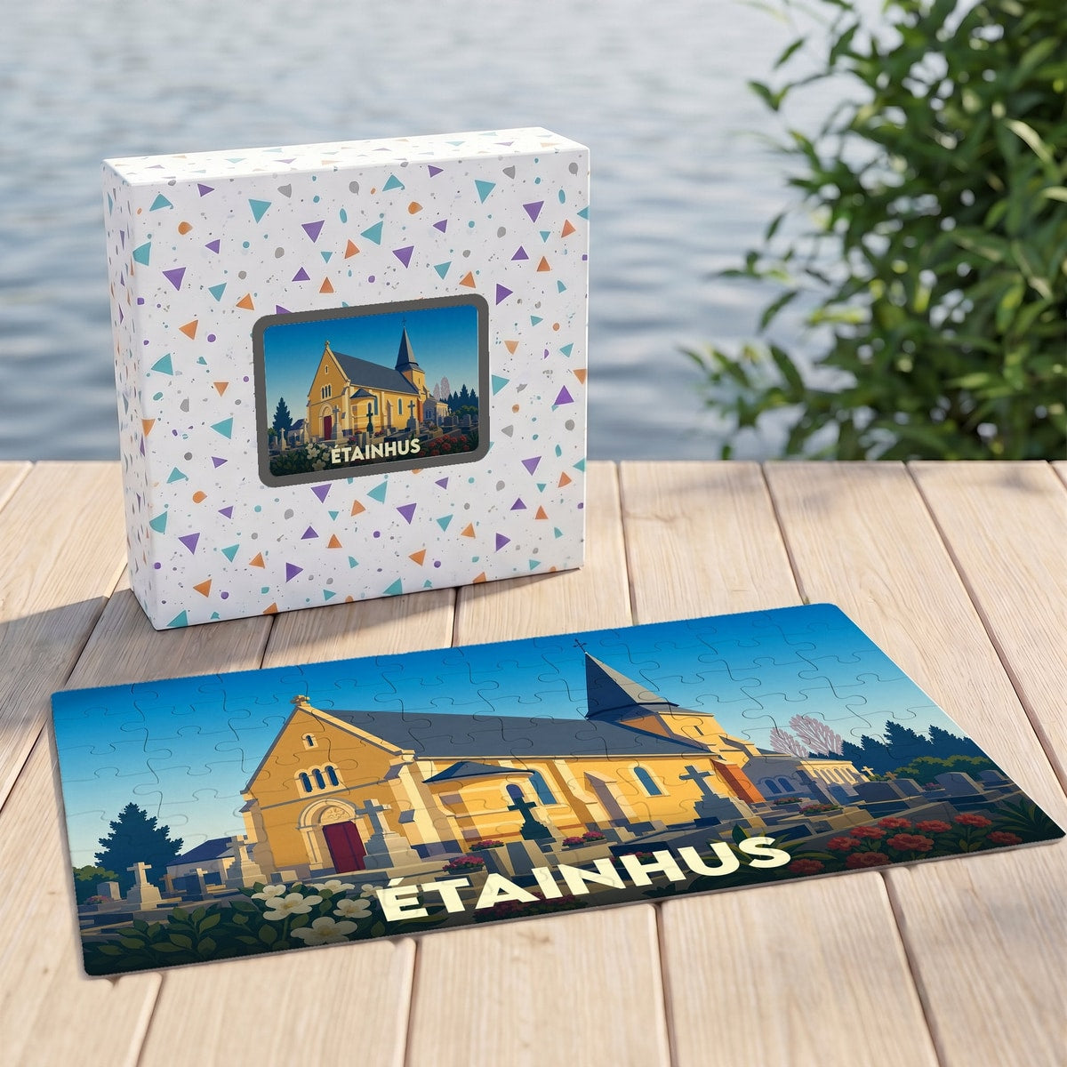 Puzzle souvenir de la ville d'Étainhus avec une illustration stylisée d'une église et de son cimetière.