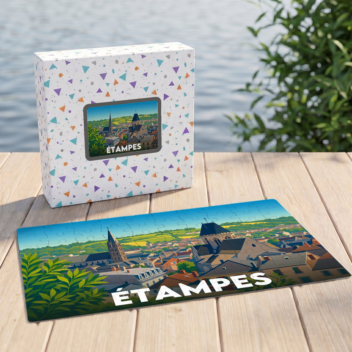 Puzzle souvenir de la ville d'Étampes illustré par une vue panoramique stylisée.