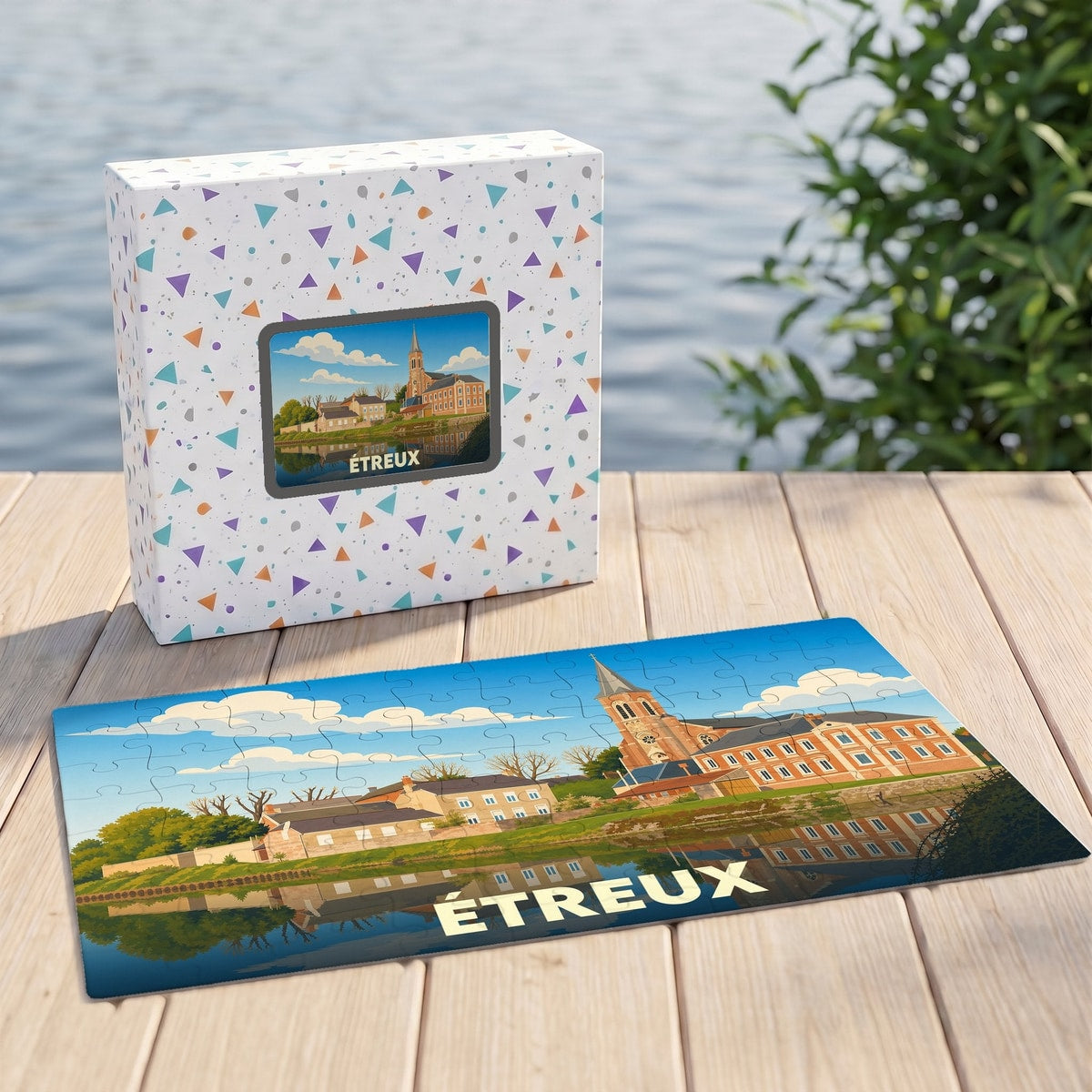 Puzzle souvenir de la ville de Étreux avec une illustration stylisée de son paysage urbain au bord de l'eau.
