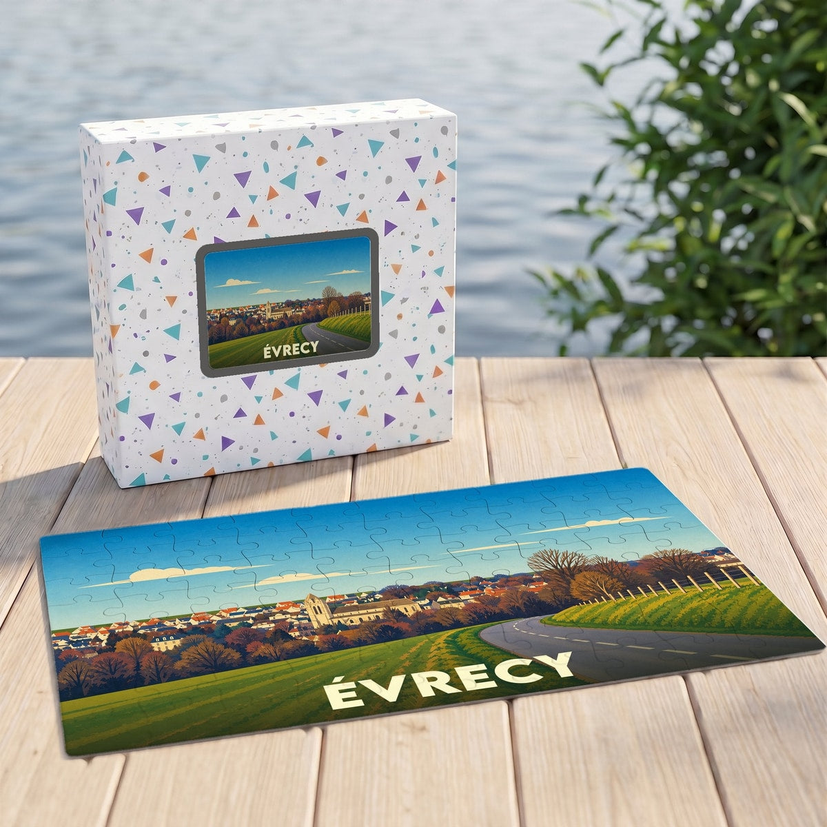 Puzzle souvenir de la ville d’Évrecy avec une illustration stylisée de son paysage urbain et de sa campagne.