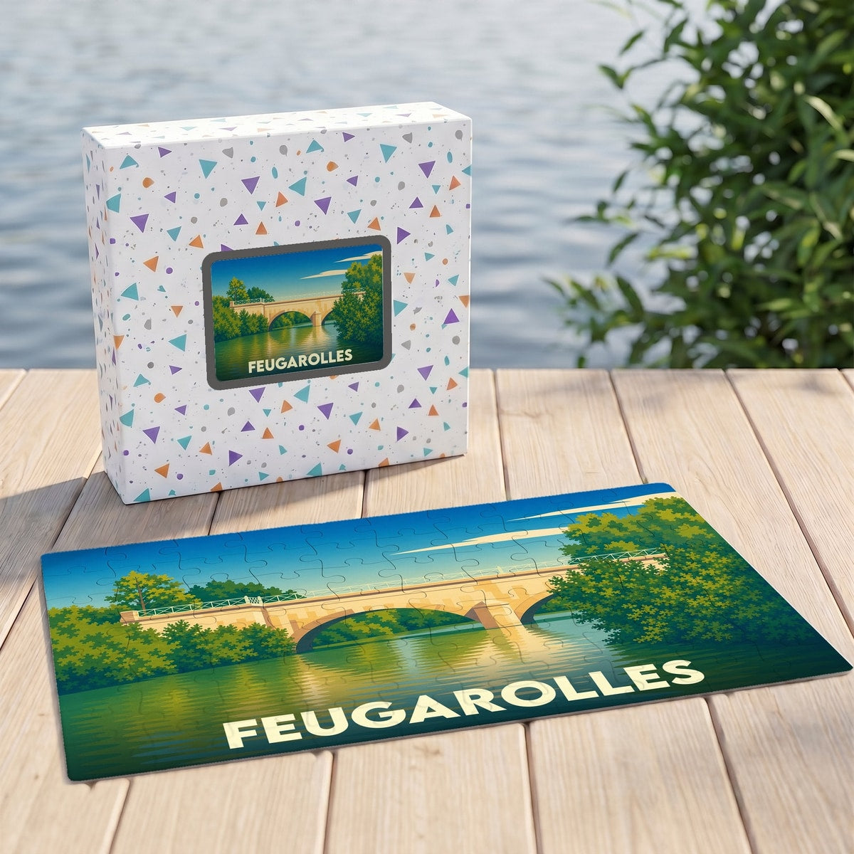 Puzzle souvenir de la ville de Feugarolles présentant une illustration stylisée d'un pont enjambant une rivière.