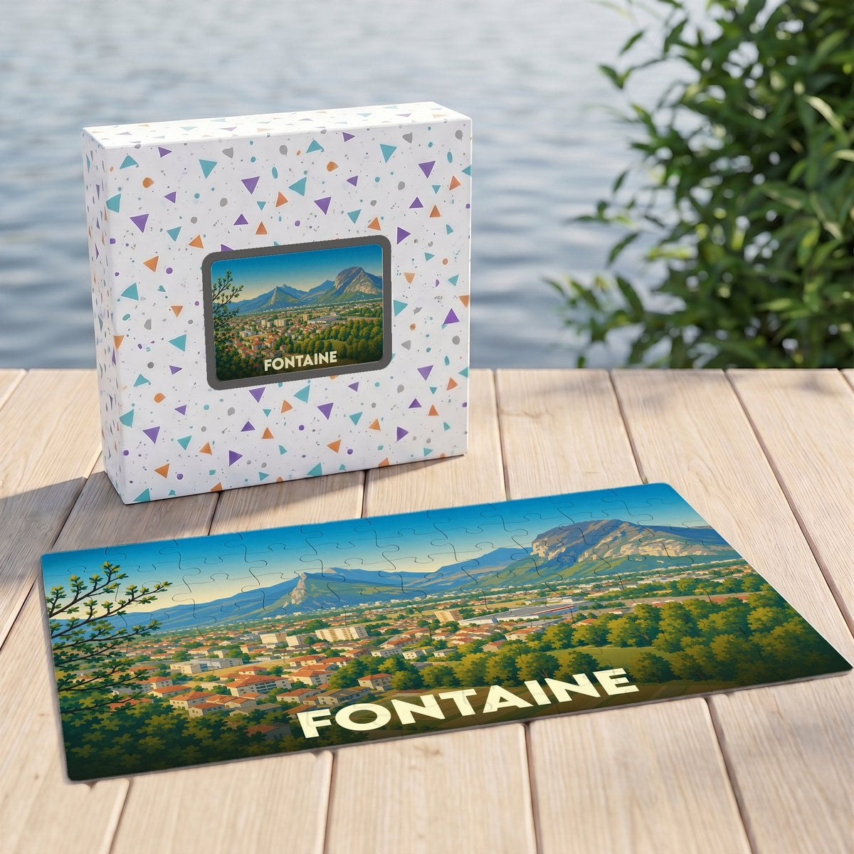 Puzzle souvenir de la ville de Fontaine représentant un paysage urbain niché au pied des montagnes.