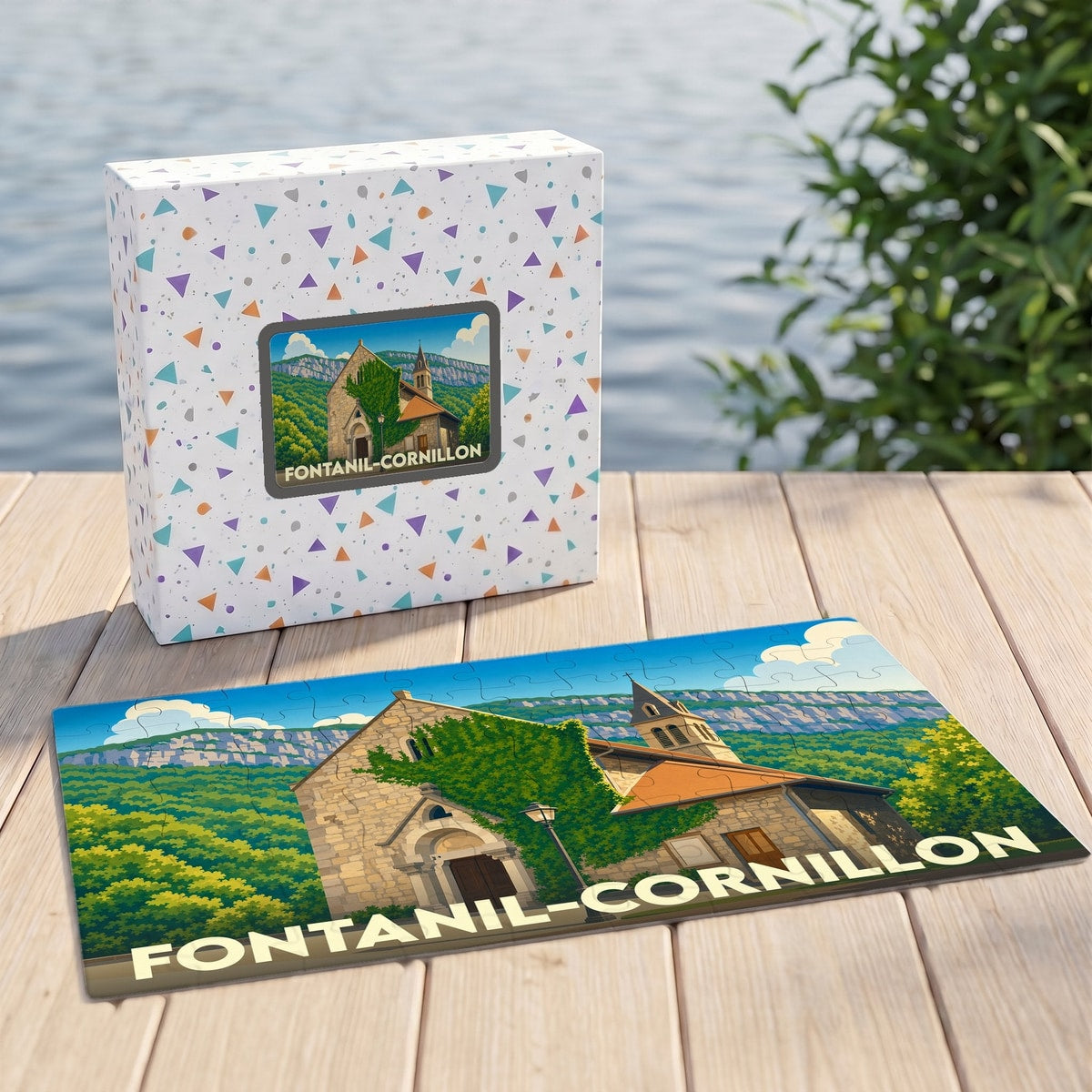 Puzzle souvenir de la ville de Fontanil-Cornillon avec une illustration stylisée d'une église sur son coffret assorti.