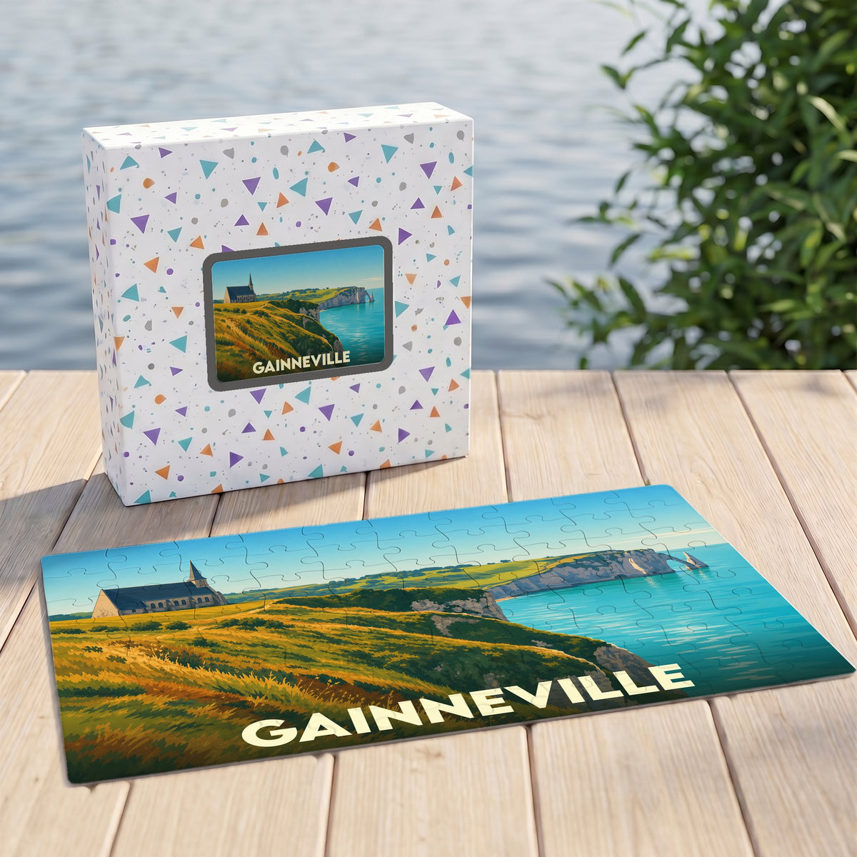 Puzzle souvenir de la ville de Gainneville avec une illustration stylisée de falaises et d'une église en bord de mer.