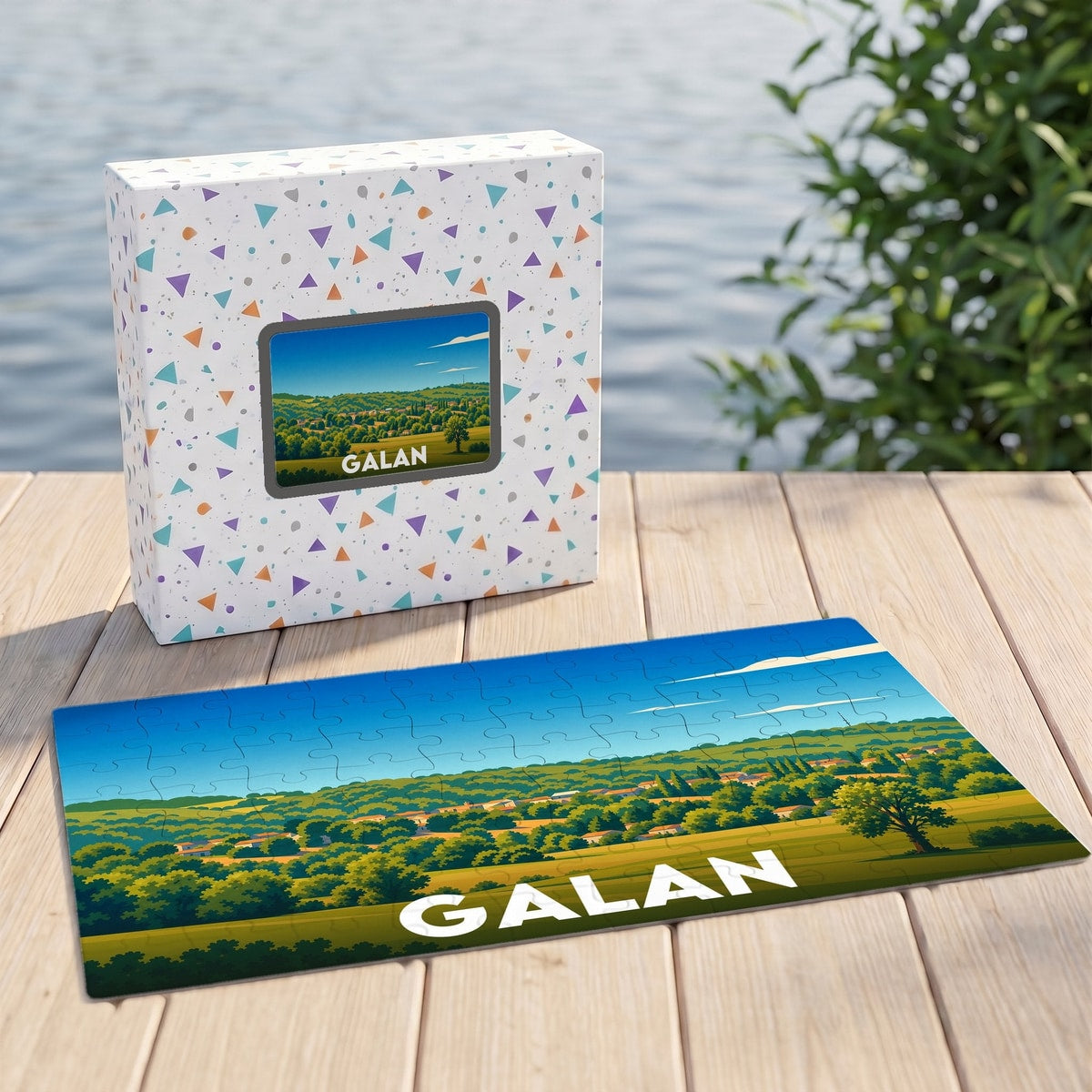 Puzzle souvenir de la ville de Galan représentant un paysage vallonné avec une illustration stylisée.