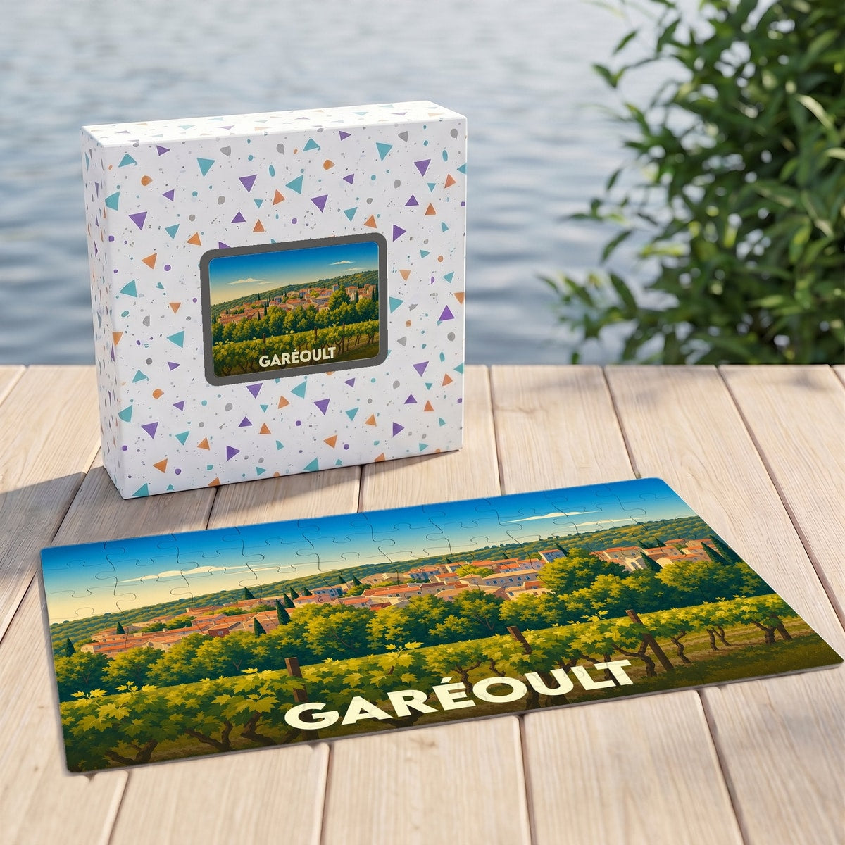 Puzzle souvenir de la ville de Garéoult représentant un paysage de vignes et de village dans un style illustré.