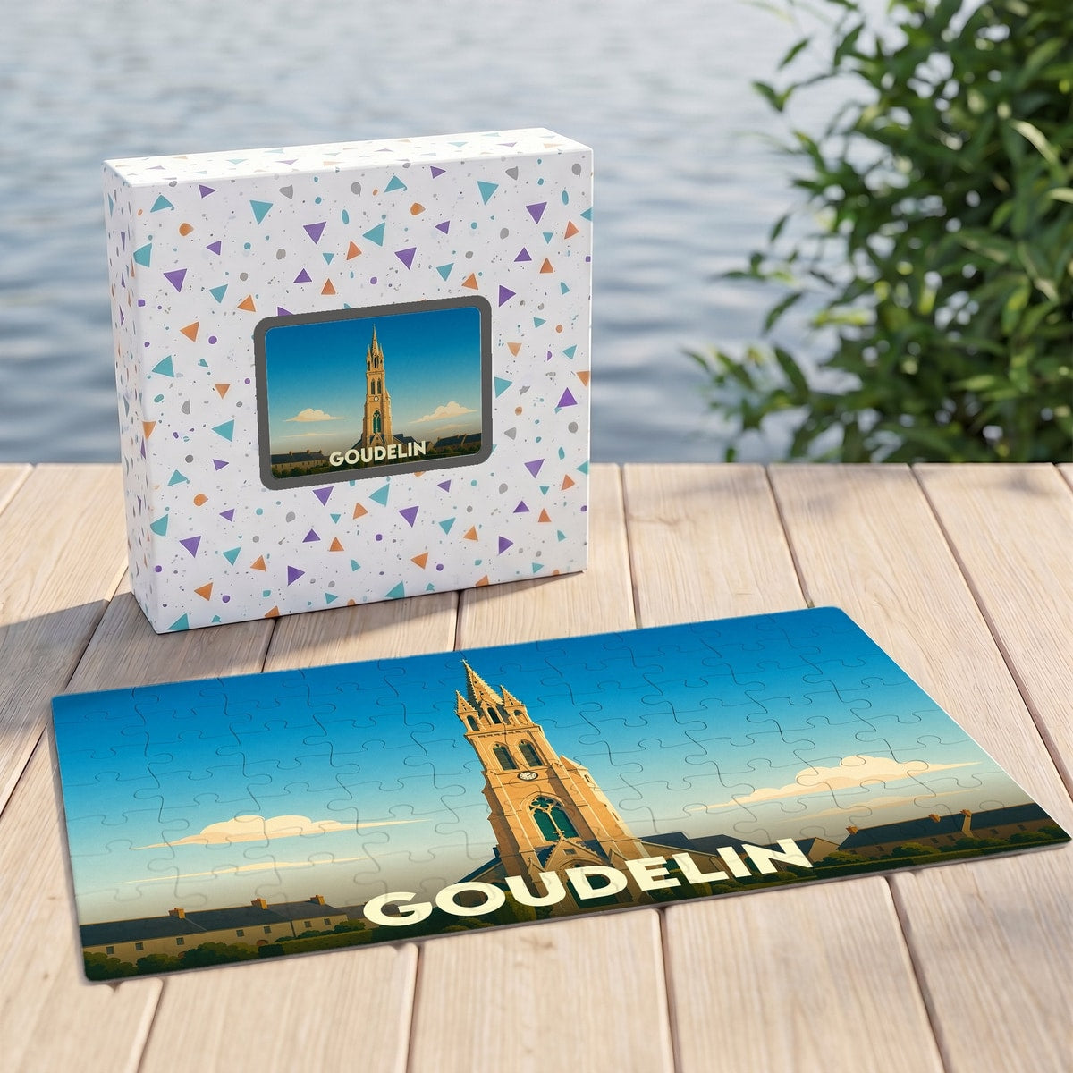 Puzzle souvenir de la ville de Goudelin avec une illustration stylisée d'un clocher.