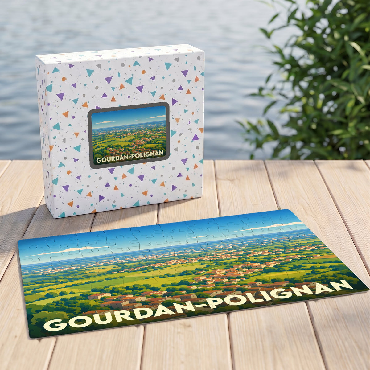 Puzzle souvenir de la ville de Gourdan-Polignan avec une illustration panoramique stylisée.