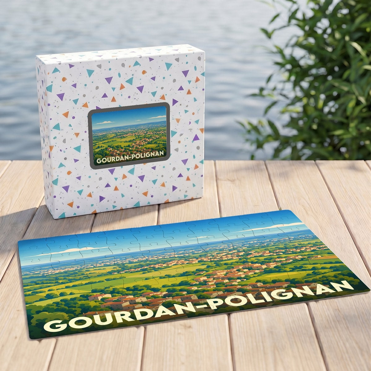 Puzzle souvenir de la ville de Gourdan-Polignan avec une illustration panoramique stylisée.