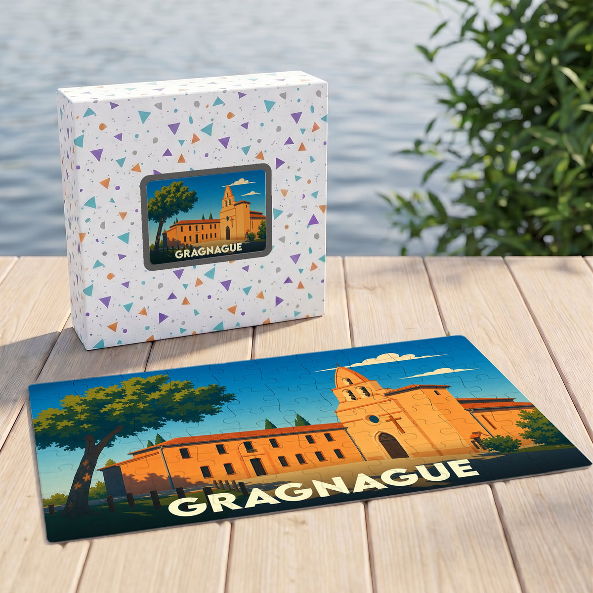 Puzzle souvenir de la ville de Gragnague avec une illustration stylisée d'un bâtiment historique sous un ciel bleu.