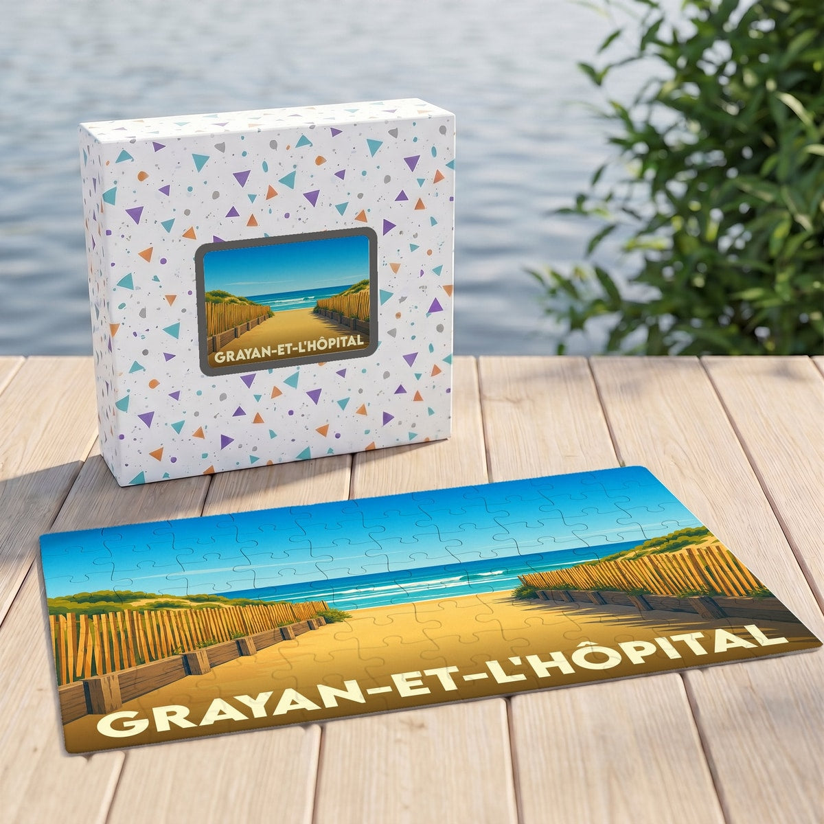 Puzzle souvenir de la ville de Grayan-et-l'Hôpital avec une illustration stylisée d'une plage.
