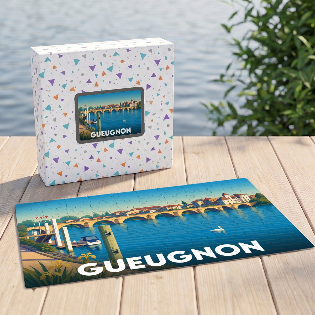 Puzzle souvenir de la ville de Gueugnon avec une illustration stylisée d'un pont et son coffret assorti.