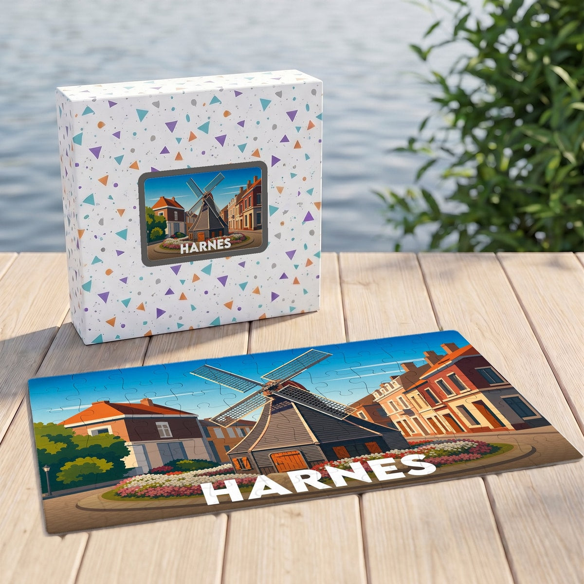Puzzle souvenir de la ville de Harnes illustré d'un moulin stylisé, présenté avec sa boîte assortie.