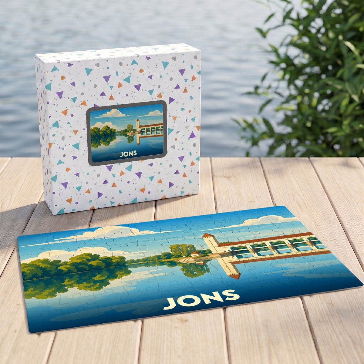 Puzzle souvenir de la ville de Jons illustrant une vue stylisée du barrage sur l'eau.