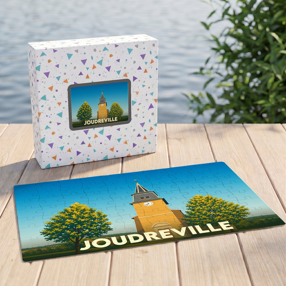 Puzzle souvenir de la ville de Joudreville avec une illustration stylisée d'un clocher.