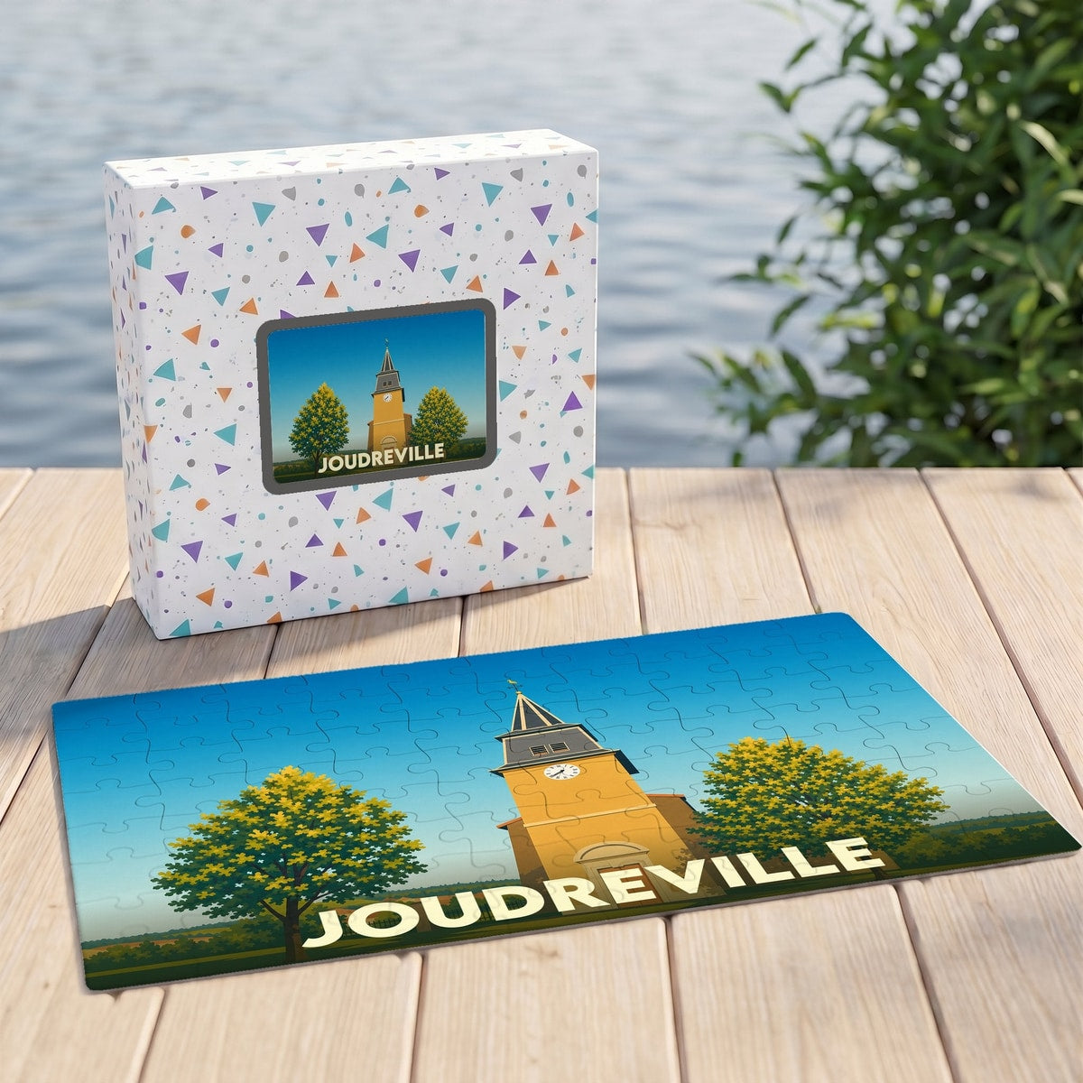 Puzzle souvenir de la ville de Joudreville avec une illustration stylisée d'un clocher.